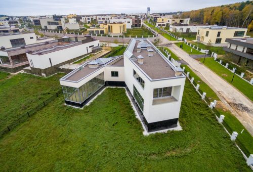 Modern country houses under construction as seen from air